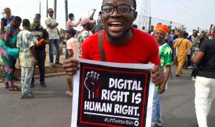A demonstrator in Lagos holds a sign advocating for digital rights amidst nationwide protests over the Nigerian government's Twitter ban. Image credit: PIUS UTOMI EKPEI/AFP via Getty Images